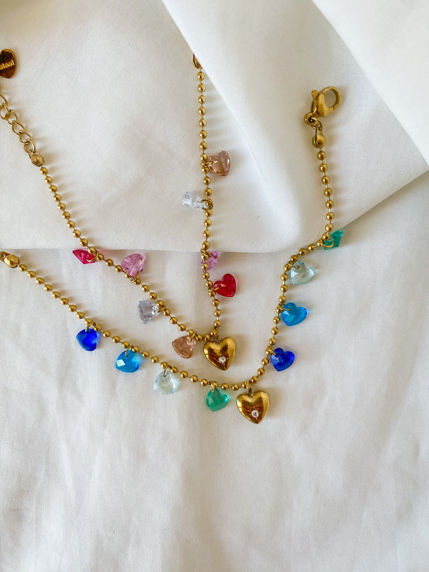 Bracciale “HARRIET” in acciaio inox colore oro, disponibile in tonalità rosa e blu