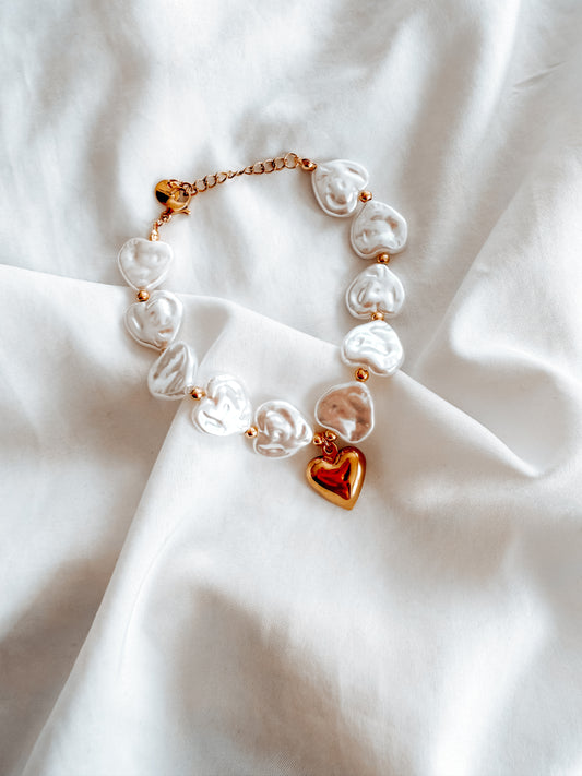 Bracciale Diana in acciaio inox con perle e ciondolo a cuore. In oro e argento
